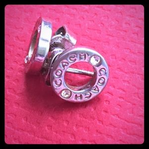 Silver coach studded earrings